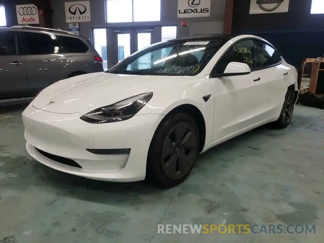 2 Photograph of a damaged car 5YJ3E1EB8NF104355 TESLA MODEL 3 2022