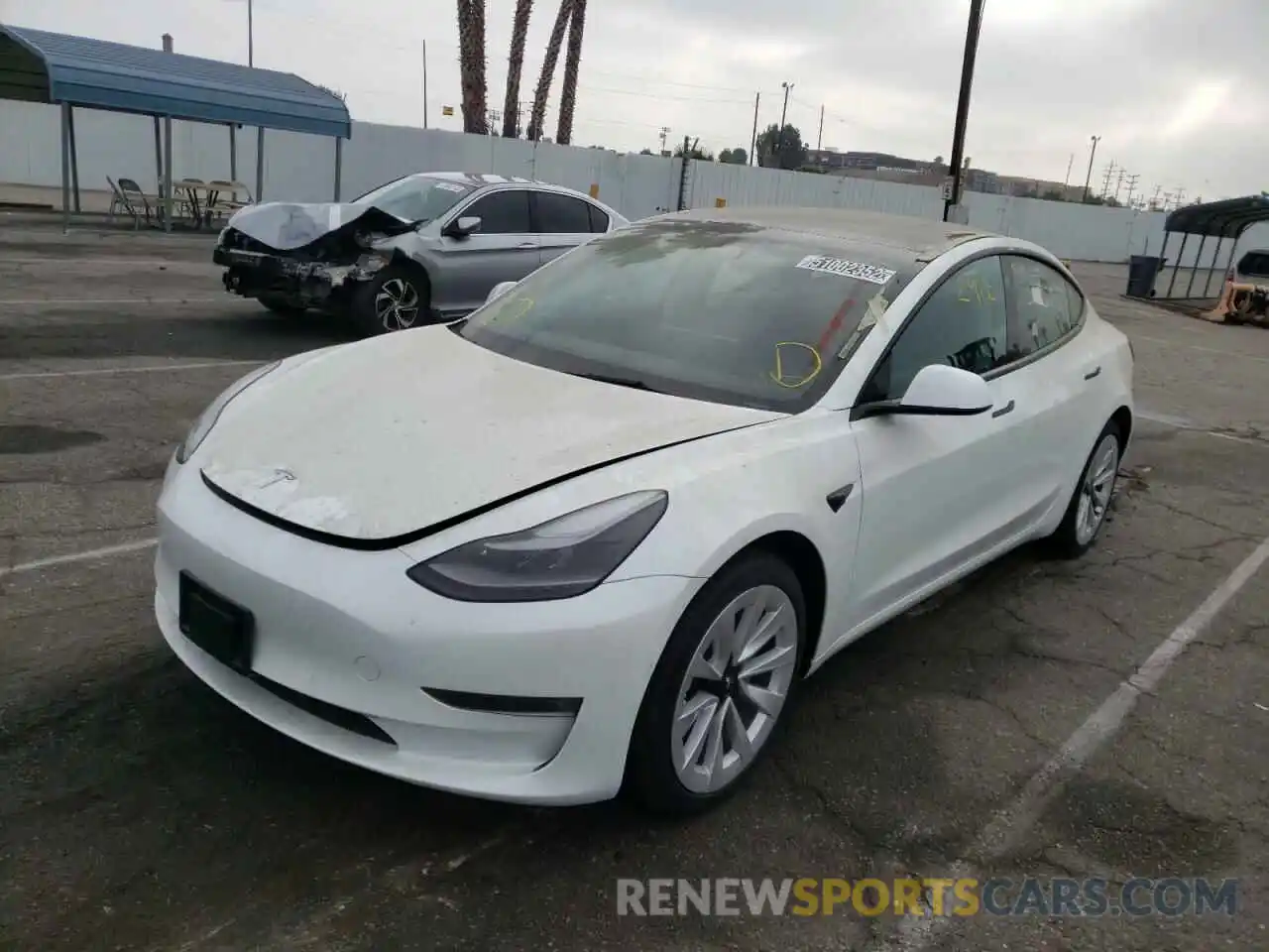 2 Photograph of a damaged car 5YJ3E1EB8NF144158 TESLA MODEL 3 2022