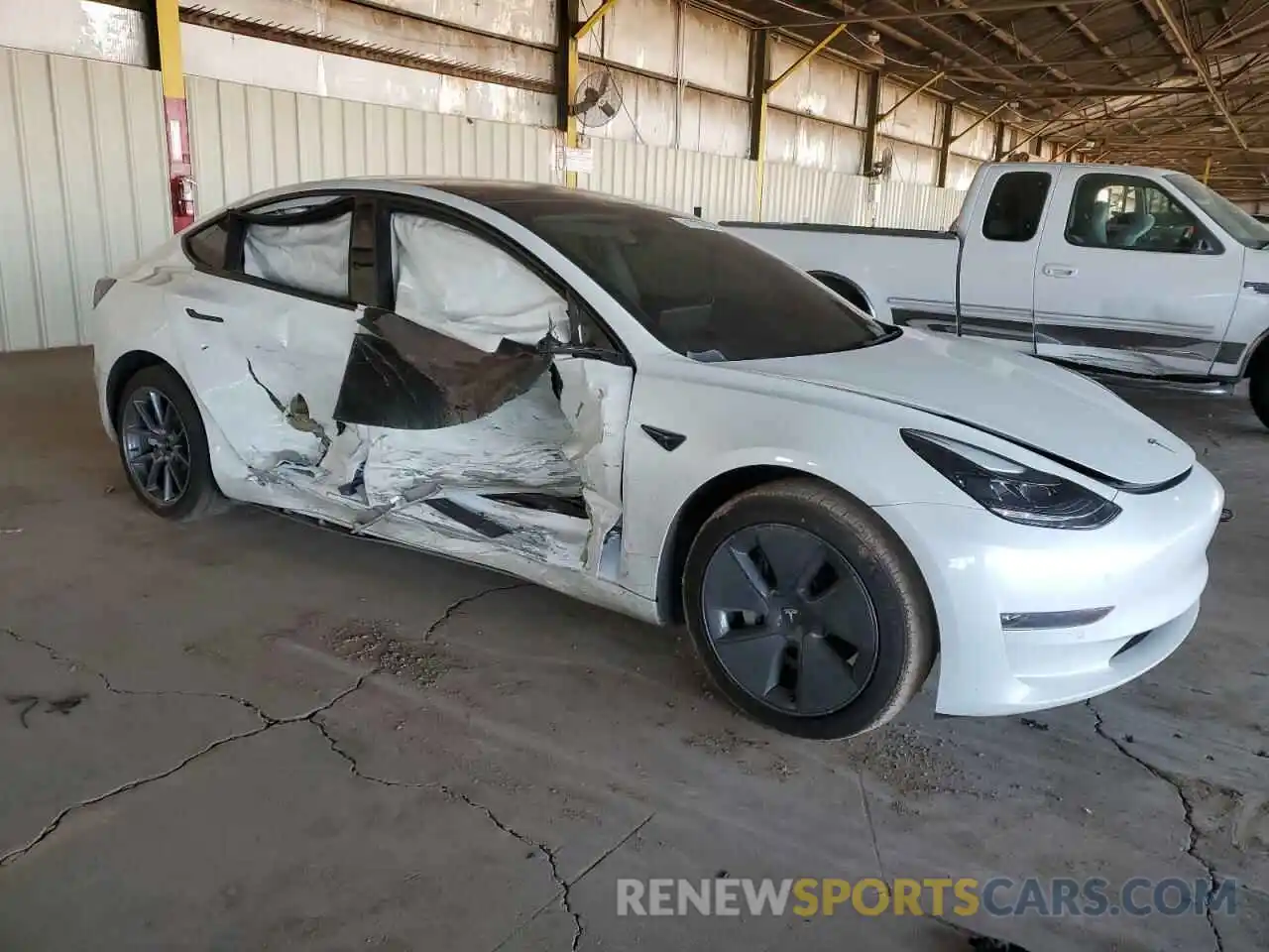 4 Photograph of a damaged car 5YJ3E1EB9NF103084 TESLA MODEL 3 2022