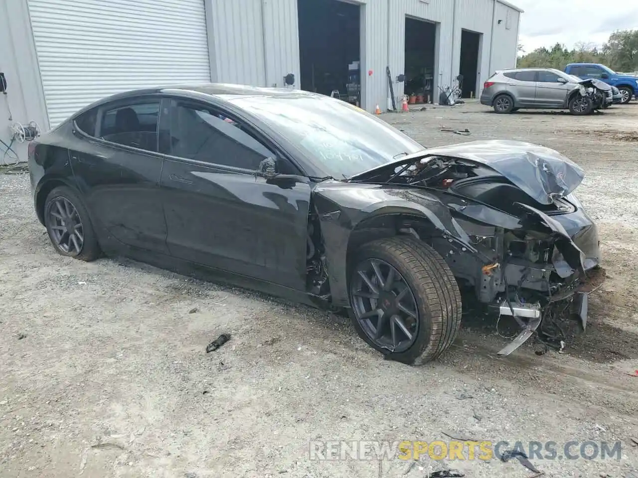 4 Photograph of a damaged car 5YJ3E1EB9NF104901 TESLA MODEL 3 2022