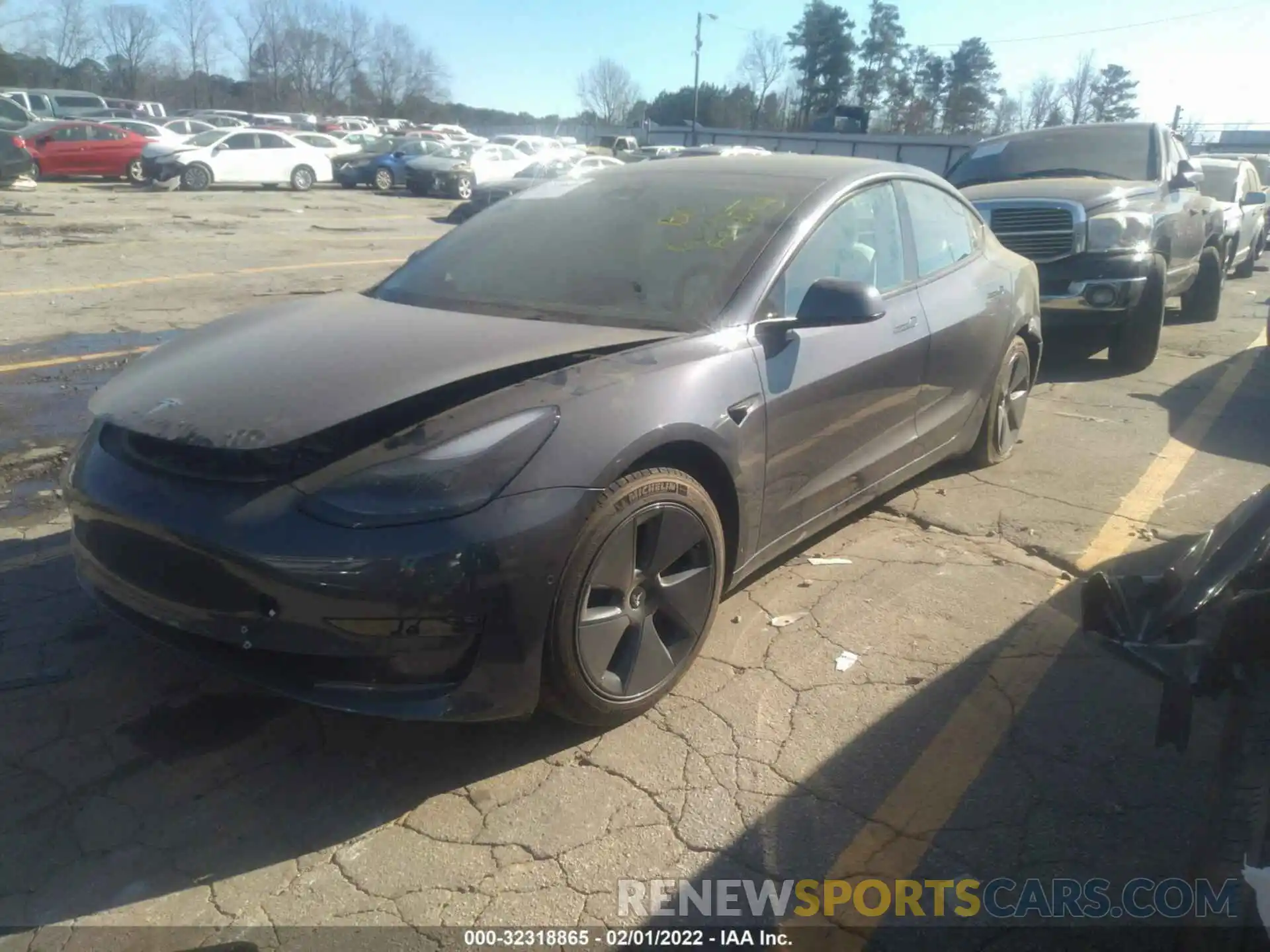 2 Photograph of a damaged car 5YJ3E1EB9NF115090 TESLA MODEL 3 2022