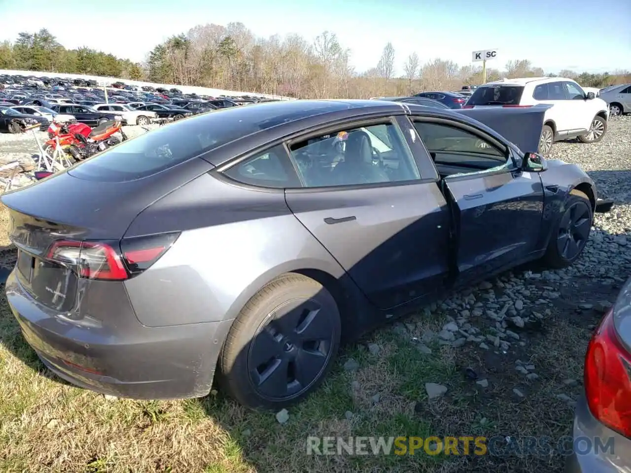 4 Photograph of a damaged car 5YJ3E1EB9NF168033 TESLA MODEL 3 2022