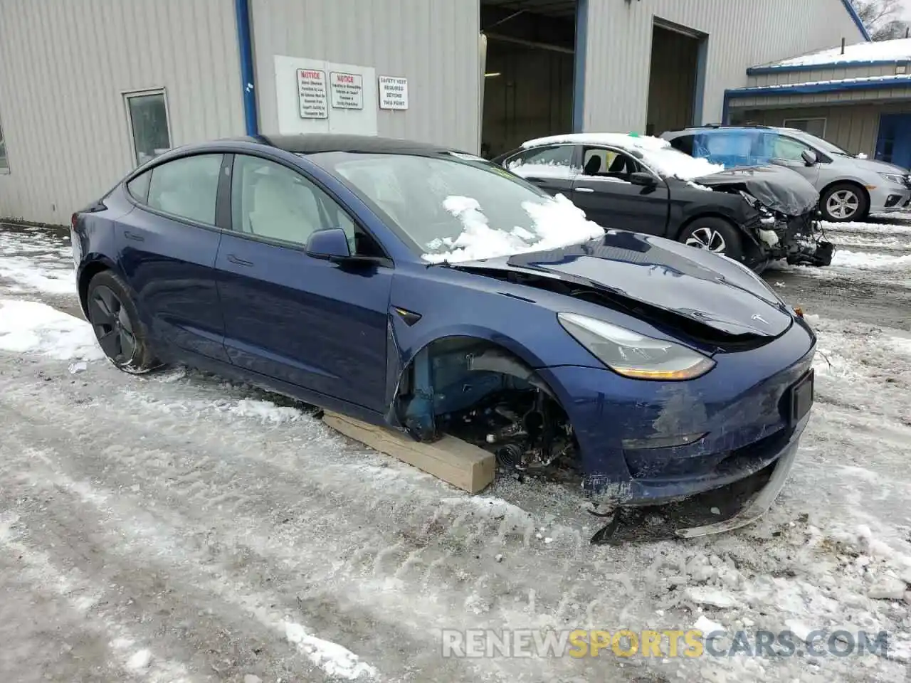 4 Photograph of a damaged car 5YJ3E1EB9NF183163 TESLA MODEL 3 2022