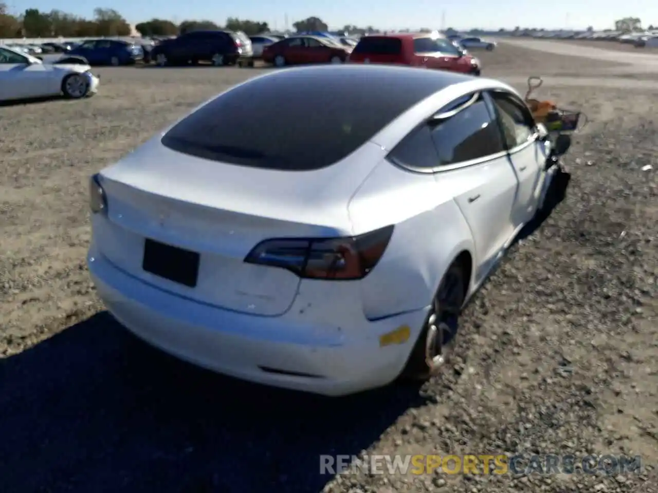 4 Photograph of a damaged car 5YJ3E1EBXNF124476 TESLA MODEL 3 2022