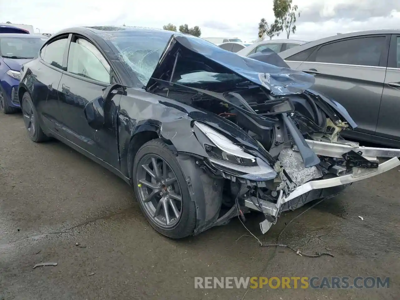 4 Photograph of a damaged car 5YJ3E1EBXNF129788 TESLA MODEL 3 2022