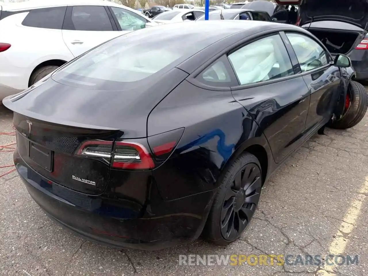 4 Photograph of a damaged car 5YJ3E1EC7NF203323 TESLA MODEL 3 2022