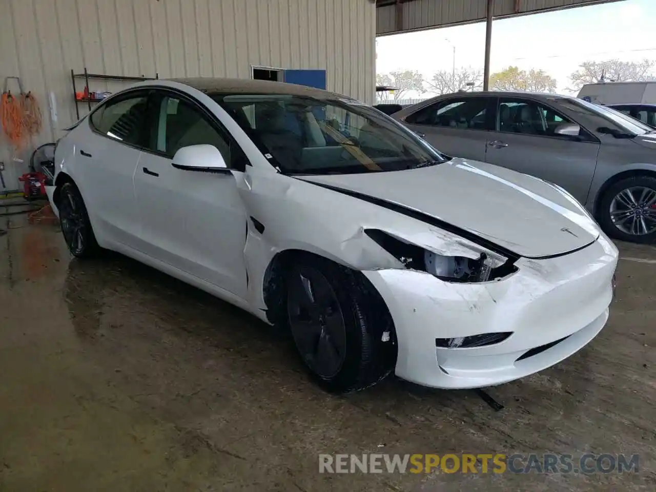 4 Photograph of a damaged car 5YJ3E1EA5PF450082 TESLA MODEL 3 2023