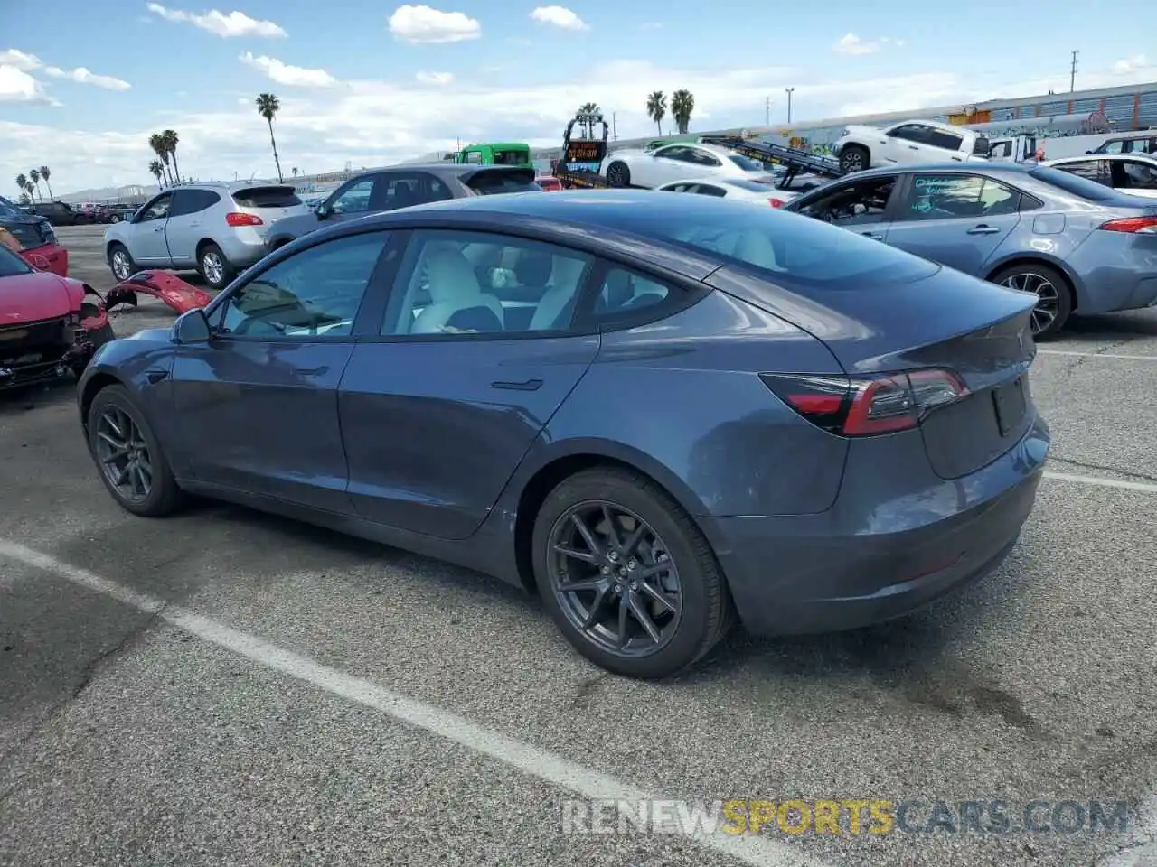 2 Photograph of a damaged car 5YJ3E1EB9PF703493 TESLA MODEL 3 2023