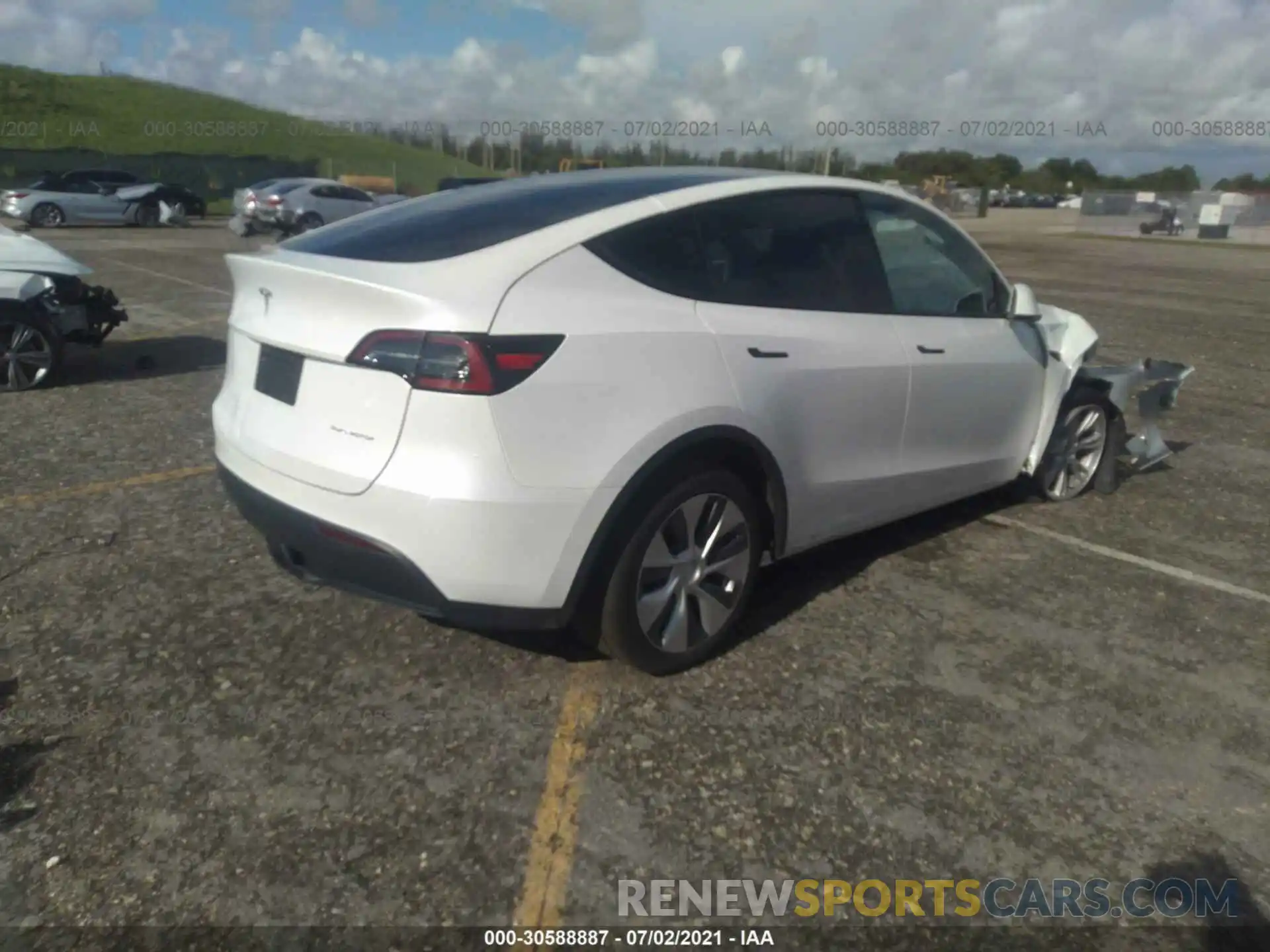 4 Photograph of a damaged car 5YJYGDEE3LF034997 TESLA MODEL Y 2020