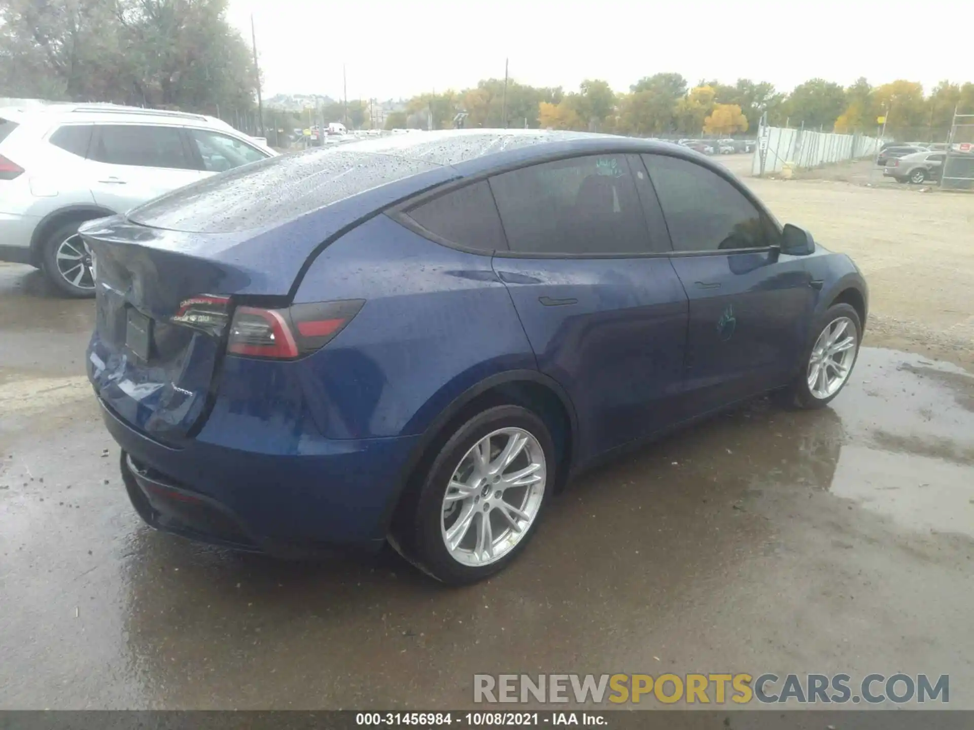 4 Photograph of a damaged car 5YJYGAEE1MF173879 TESLA MODEL Y 2021