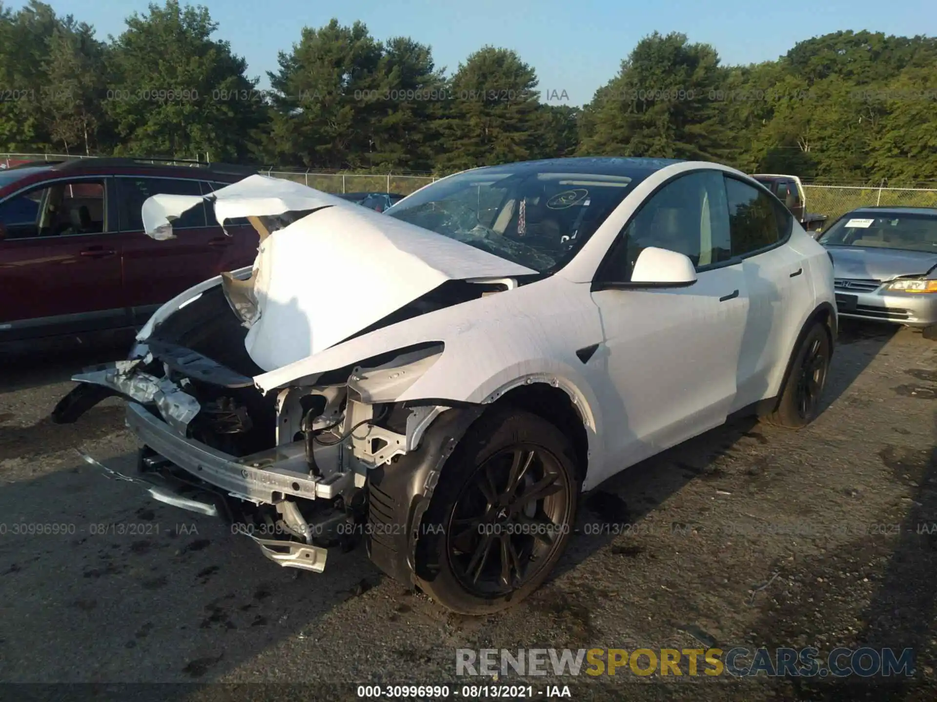 2 Photograph of a damaged car 5YJYGDED8MF109587 TESLA MODEL Y 2021