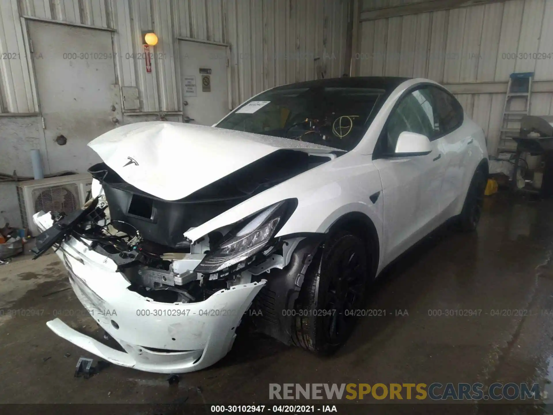 2 Photograph of a damaged car 5YJYGDEE7MF119858 TESLA MODEL Y 2021