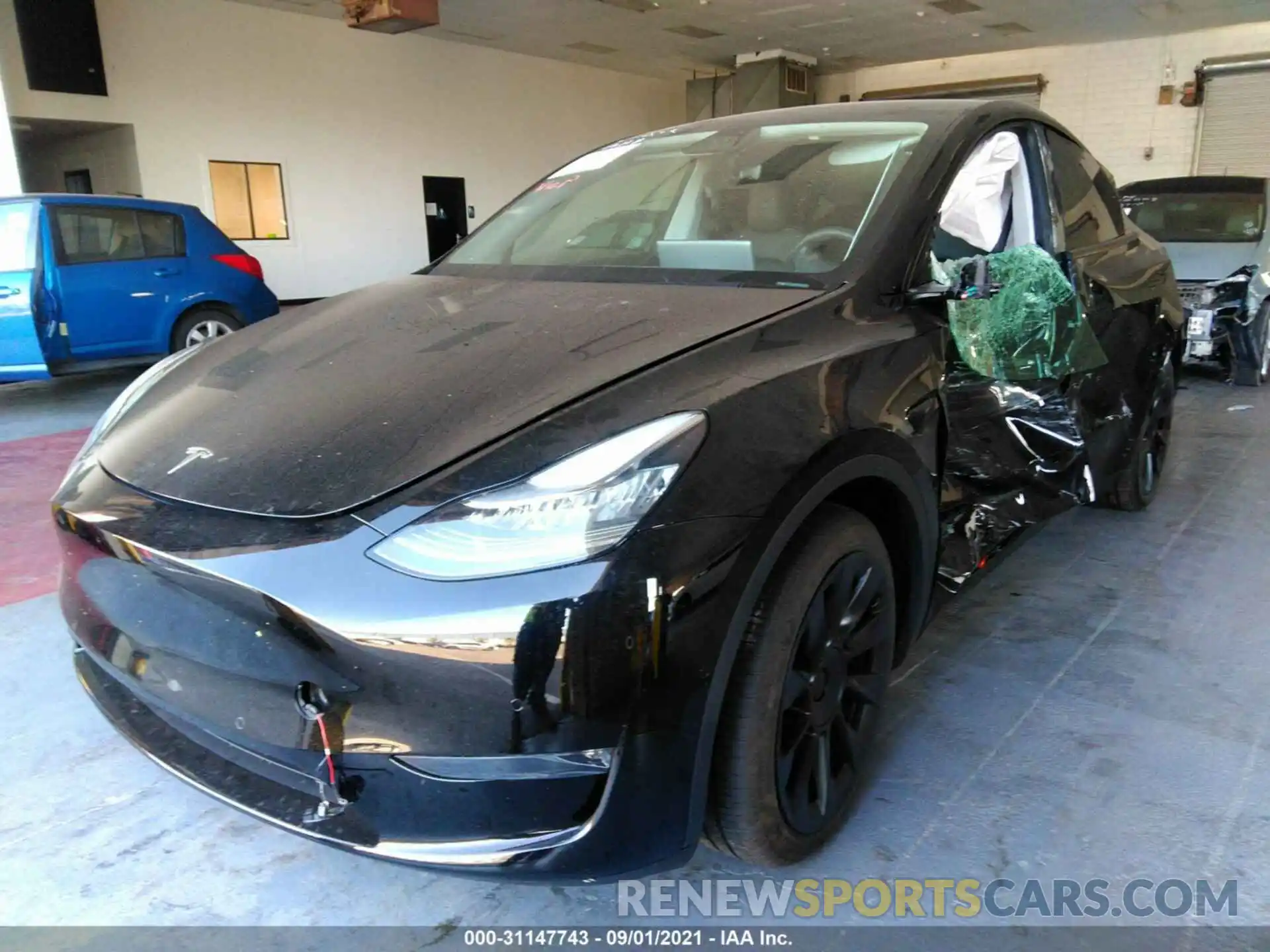 2 Photograph of a damaged car 5YJYGDEE9MF065382 TESLA MODEL Y 2021