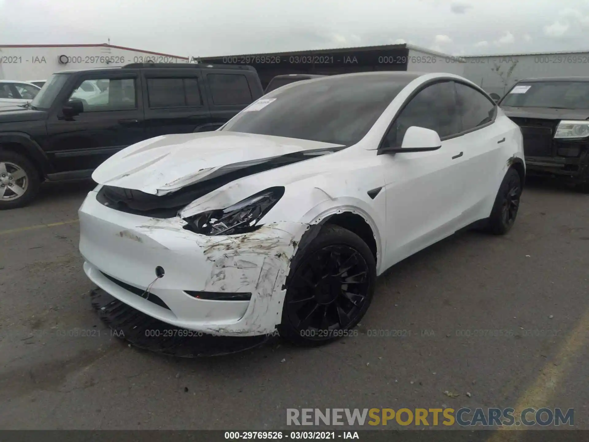 2 Photograph of a damaged car 5YJYGDEE9MF075815 TESLA MODEL Y 2021