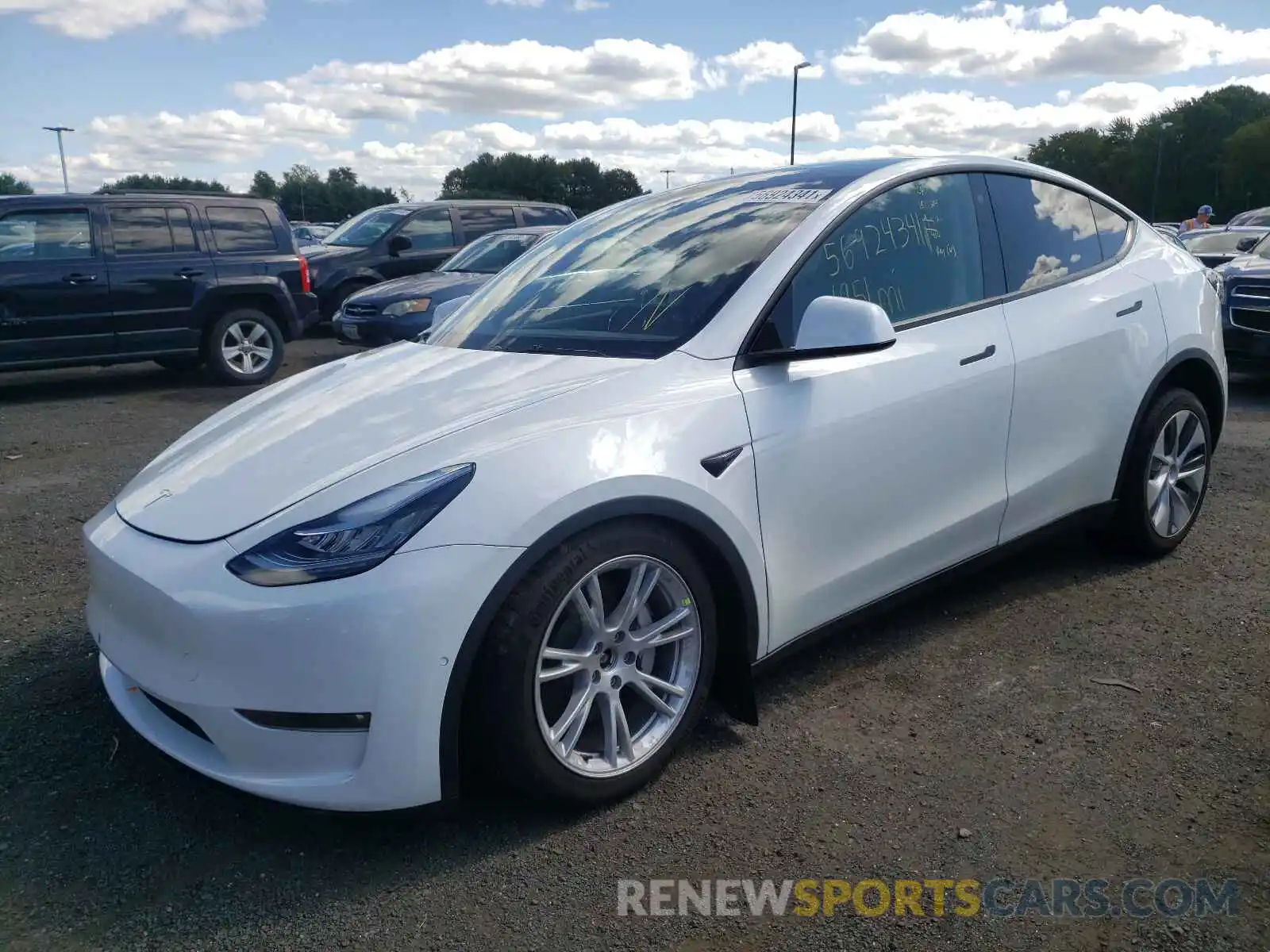 2 Photograph of a damaged car 5YJYGDEE9MF204877 TESLA MODEL Y 2021