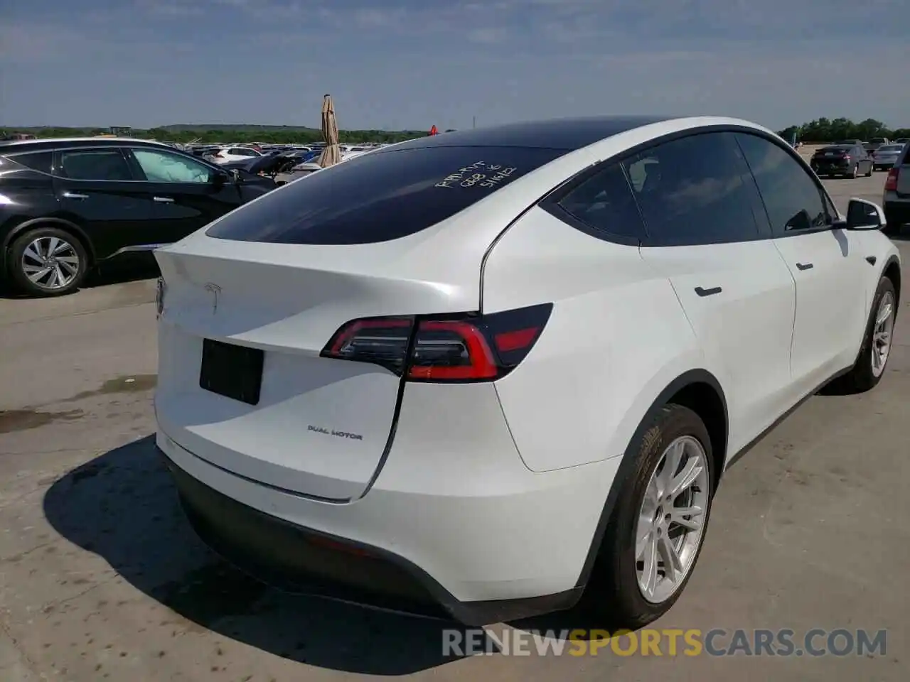 4 Photograph of a damaged car 5YJYGDEEXMF072731 TESLA MODEL Y 2021