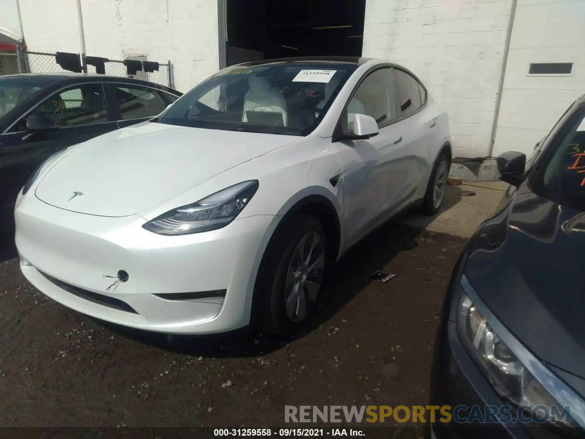 2 Photograph of a damaged car 5YJYGDEEXMF228704 TESLA MODEL Y 2021