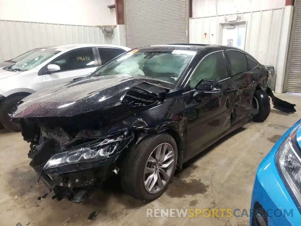 2 Photograph of a damaged car 4T1BZ1FB8KU013499 TOYOTA AVALON 2019