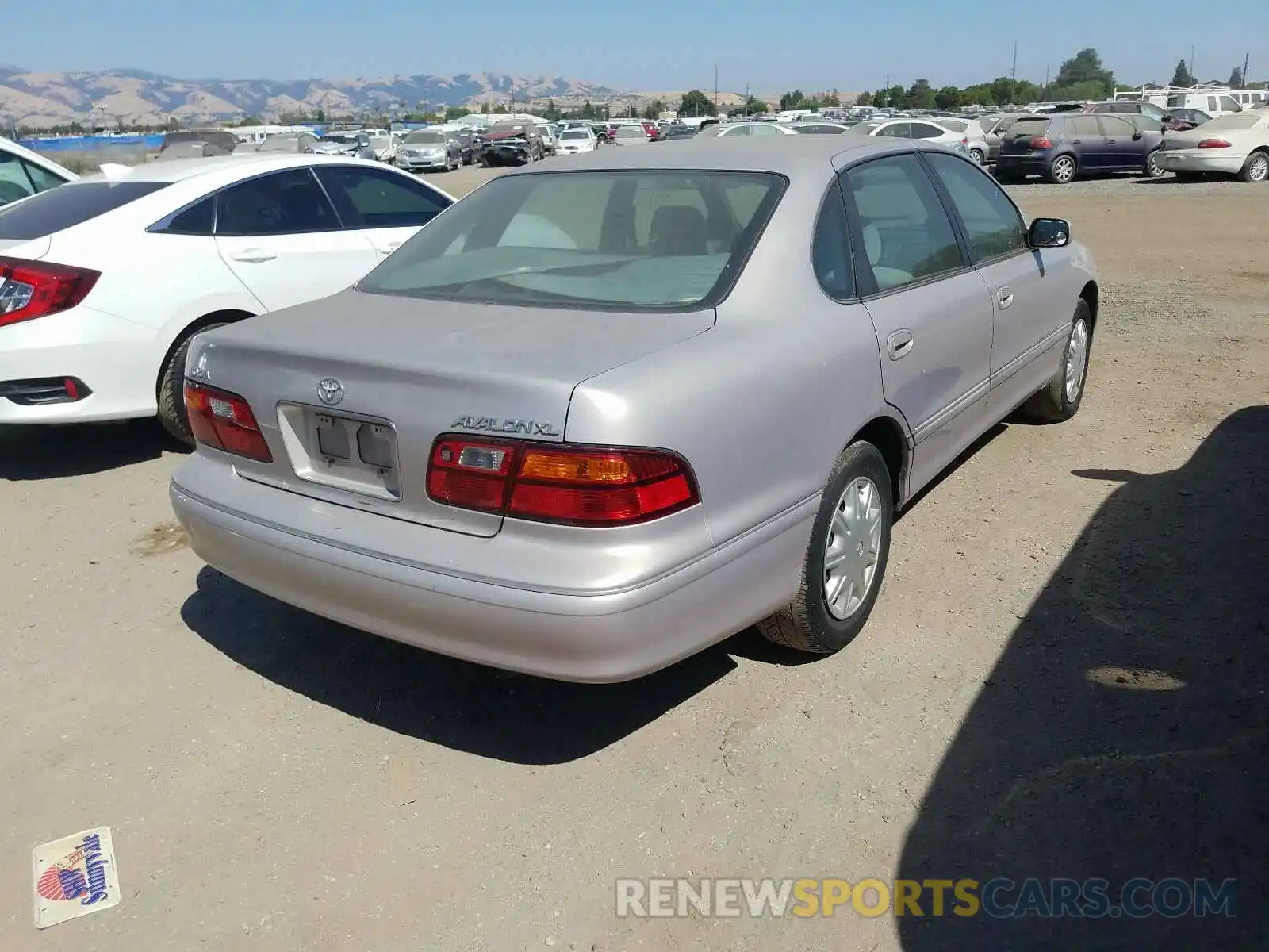 4 Photograph of a damaged car 4T1BF18B5XU331495 TOYOTA AVALON 2099