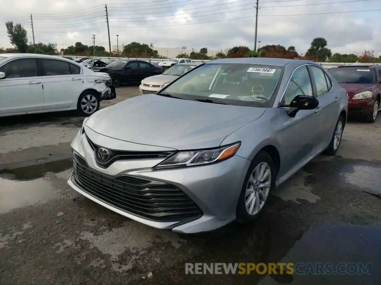 2 Photograph of a damaged car 4T1B11HK0KU230890 TOYOTA CAMRY 2019