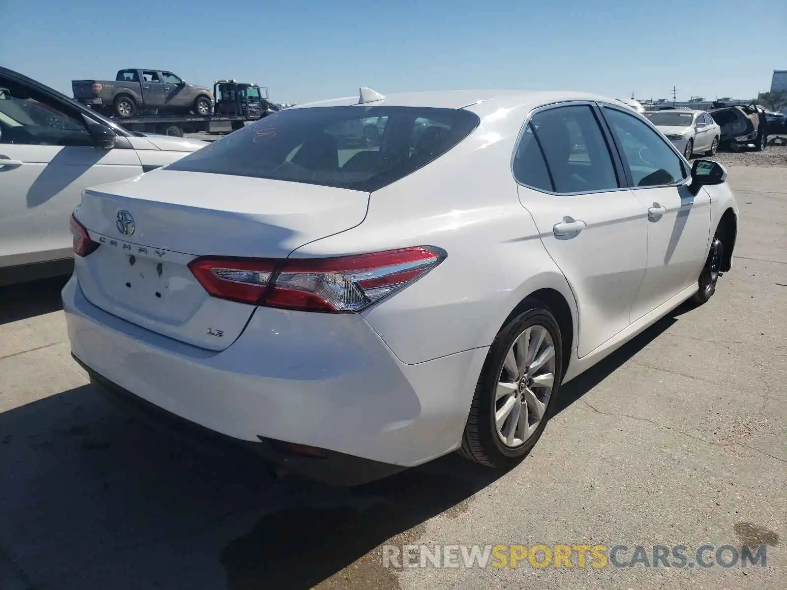 4 Photograph of a damaged car 4T1B11HK0KU240299 TOYOTA CAMRY 2019