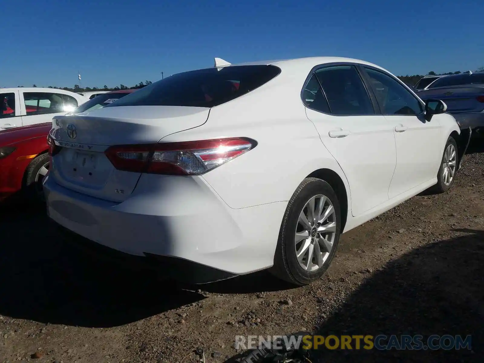 4 Photograph of a damaged car 4T1B11HK0KU243543 TOYOTA CAMRY 2019