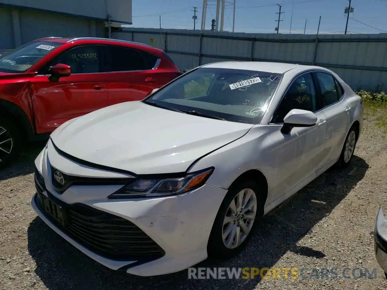 2 Photograph of a damaged car 4T1B11HK0KU243915 TOYOTA CAMRY 2019