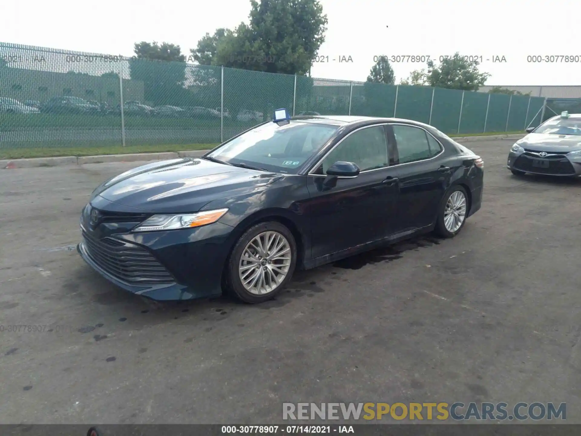 2 Photograph of a damaged car 4T1B11HK0KU244661 TOYOTA CAMRY 2019