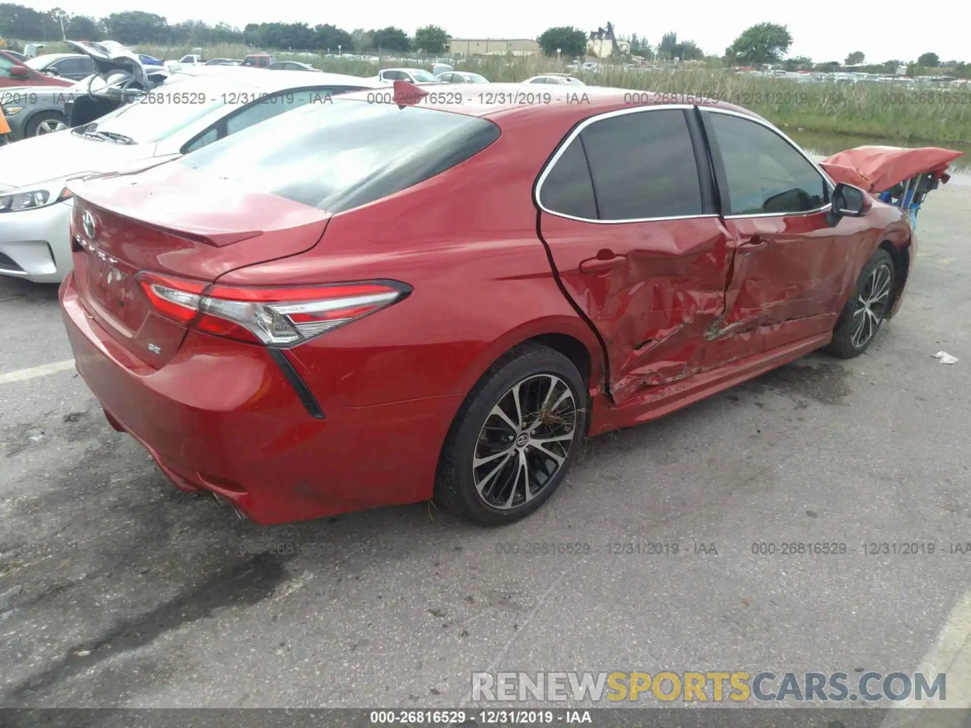 4 Photograph of a damaged car 4T1B11HK0KU264599 TOYOTA CAMRY 2019