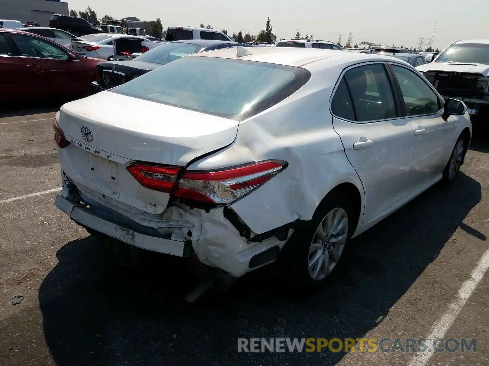 4 Photograph of a damaged car 4T1B11HK0KU270032 TOYOTA CAMRY 2019