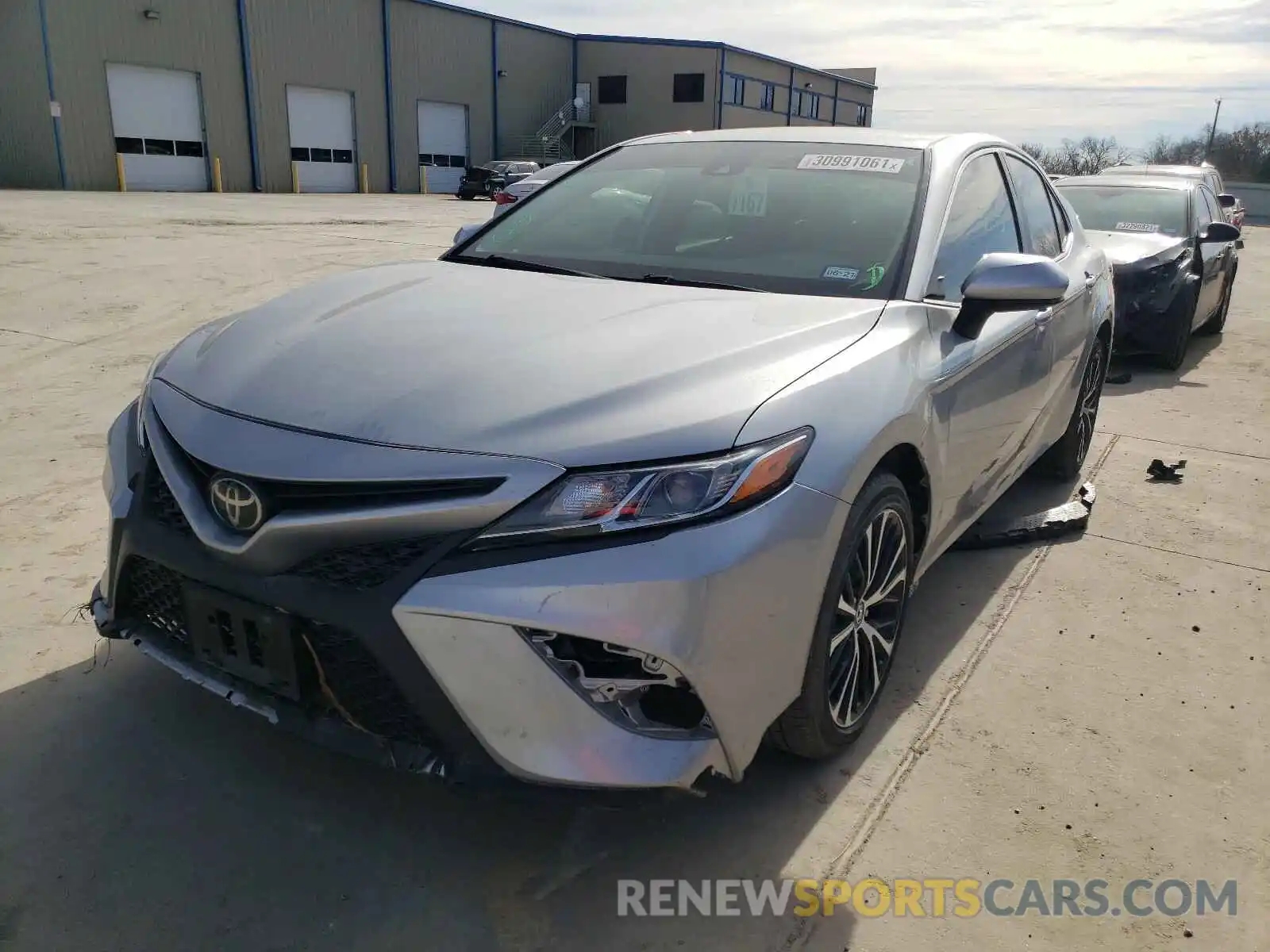 2 Photograph of a damaged car 4T1B11HK0KU691796 TOYOTA CAMRY 2019