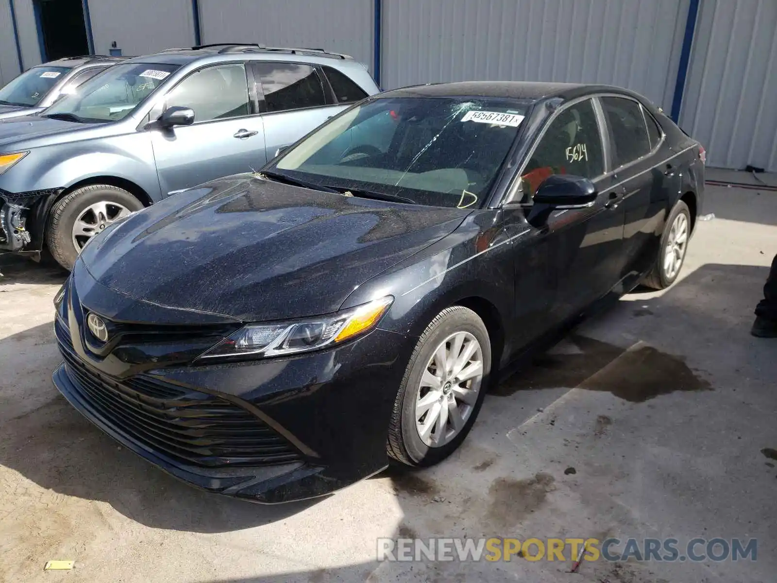 2 Photograph of a damaged car 4T1B11HK0KU702621 TOYOTA CAMRY 2019