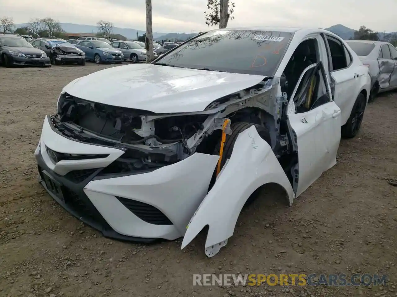 2 Photograph of a damaged car 4T1B11HK0KU715112 TOYOTA CAMRY 2019