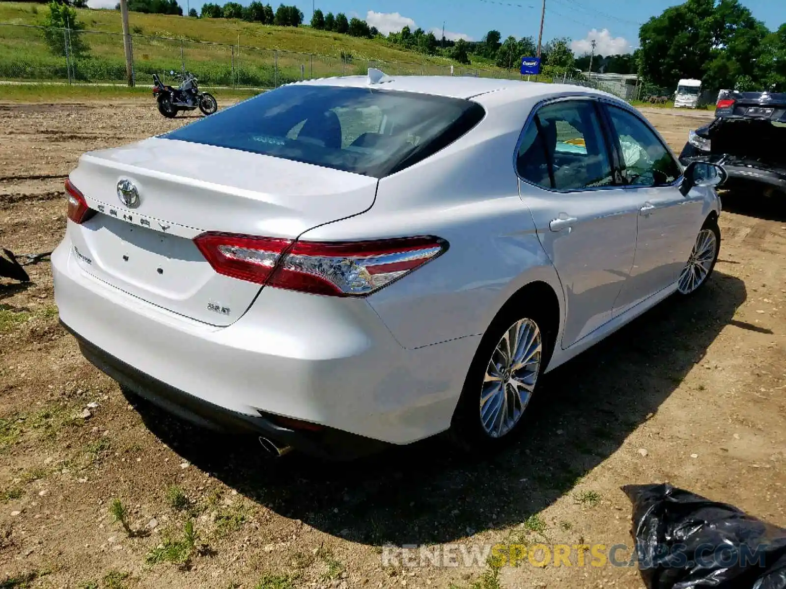 4 Photograph of a damaged car 4T1B11HK0KU715689 TOYOTA CAMRY 2019