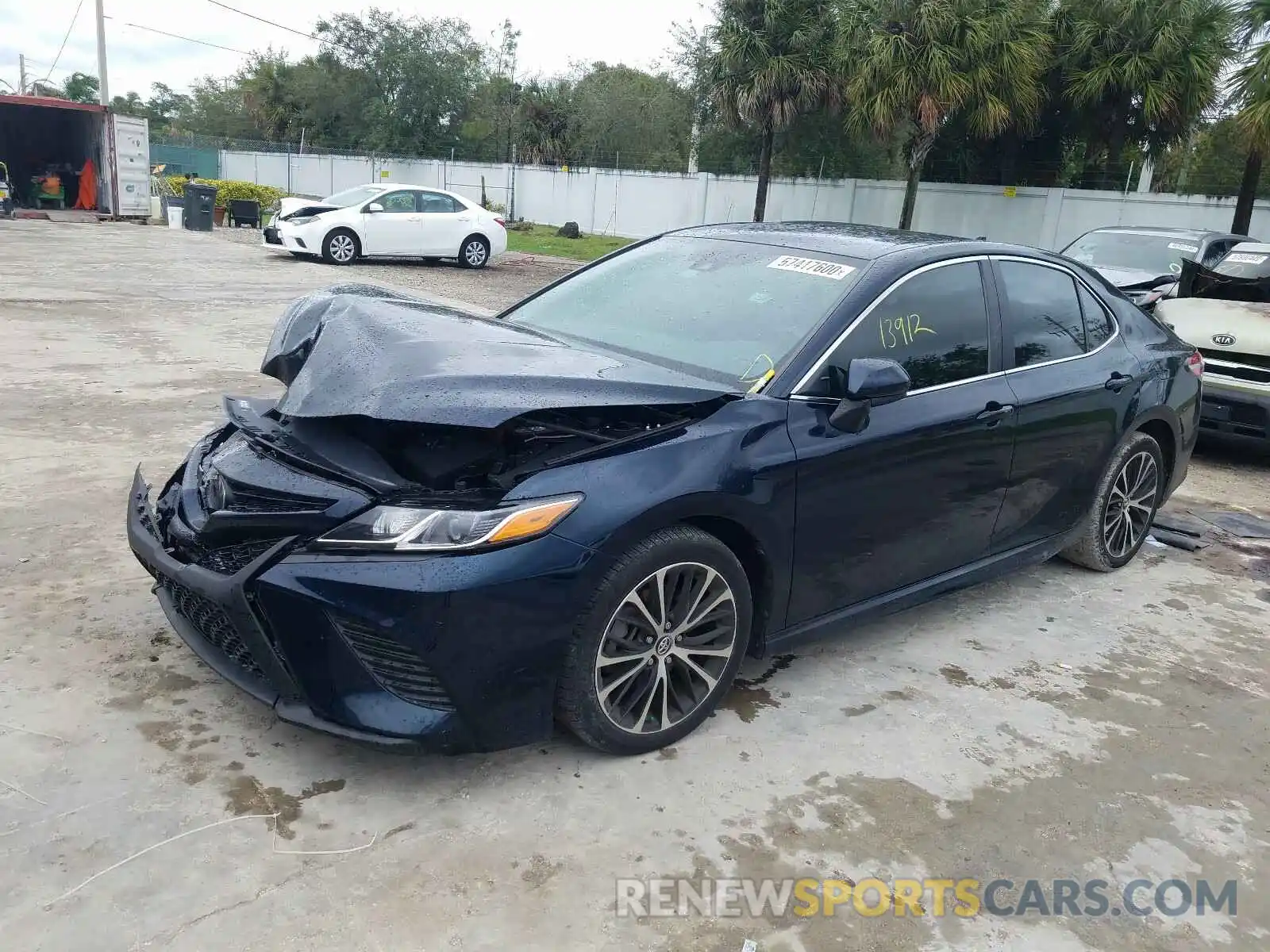 2 Photograph of a damaged car 4T1B11HK0KU740883 TOYOTA CAMRY 2019