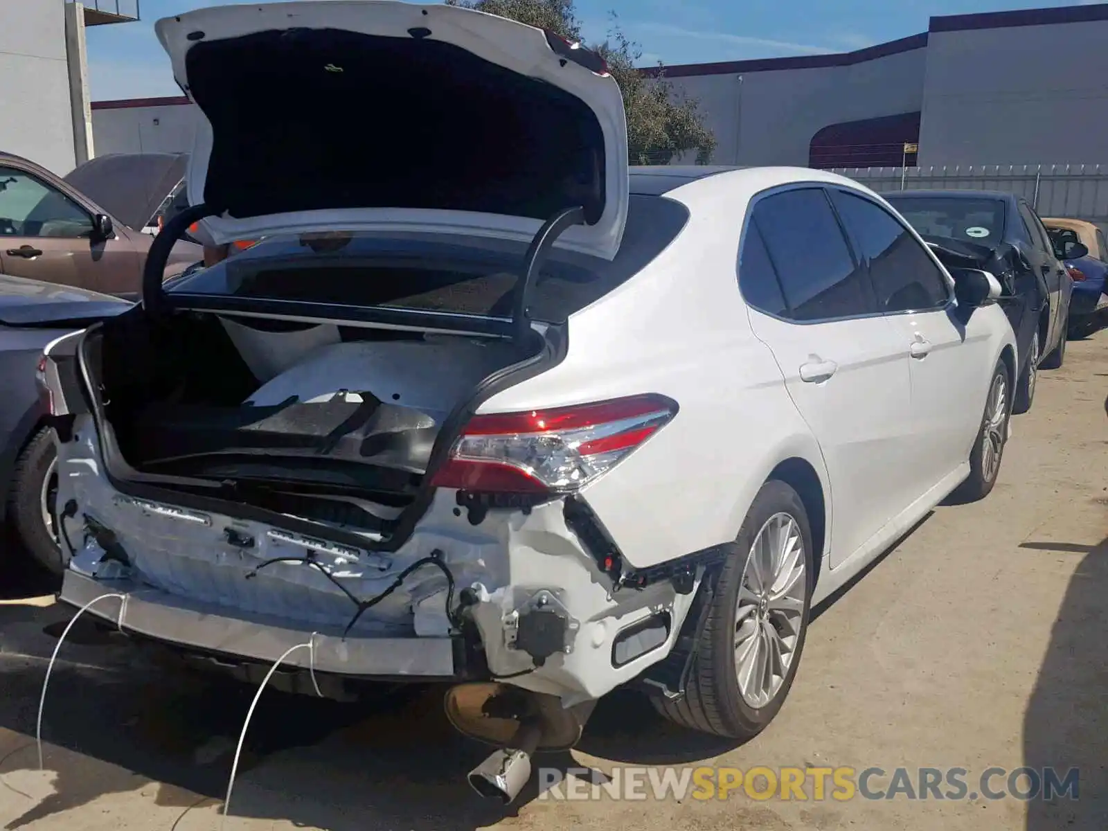 4 Photograph of a damaged car 4T1B11HK0KU756615 TOYOTA CAMRY 2019