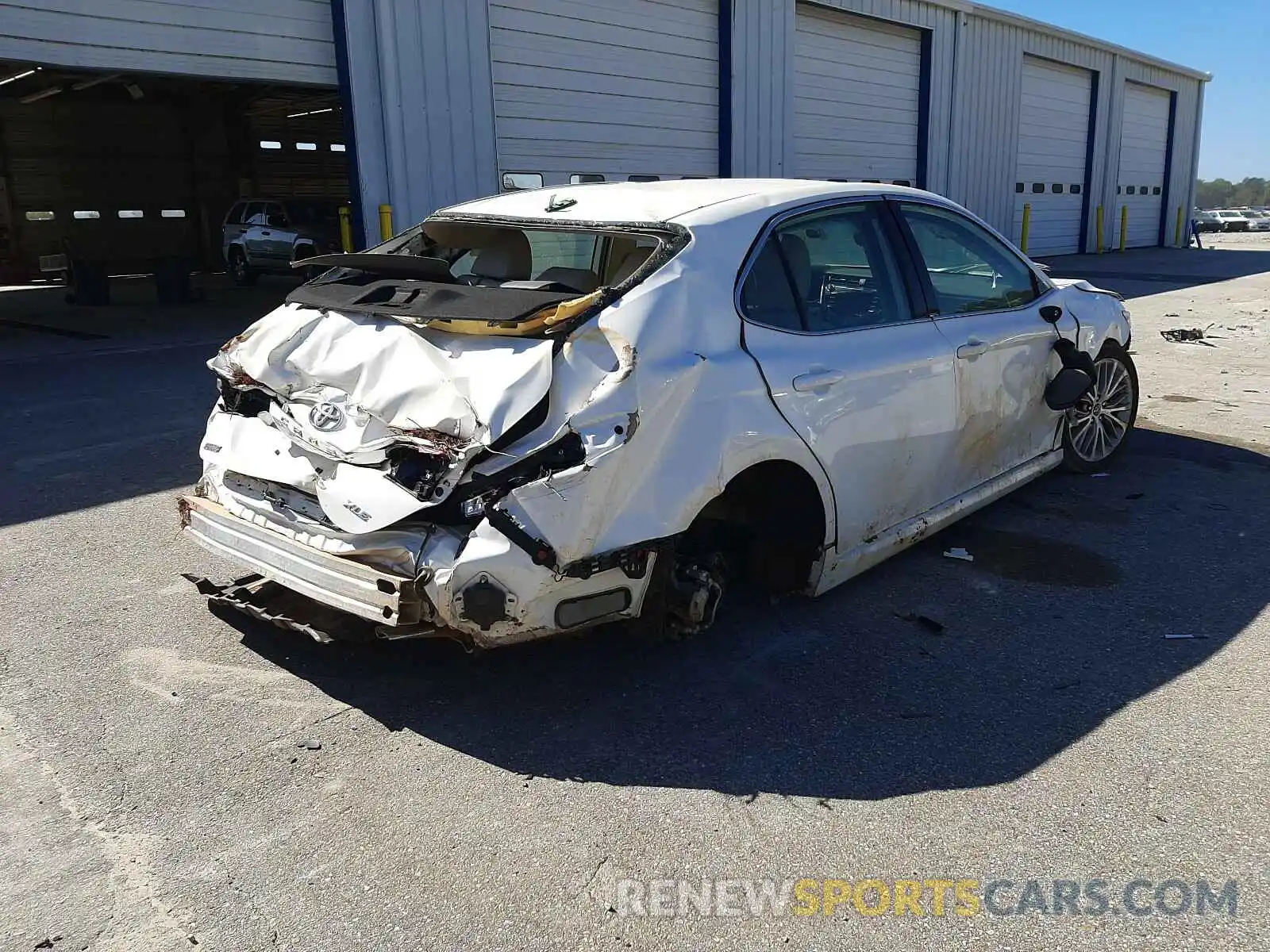 4 Photograph of a damaged car 4T1B11HK0KU768070 TOYOTA CAMRY 2019