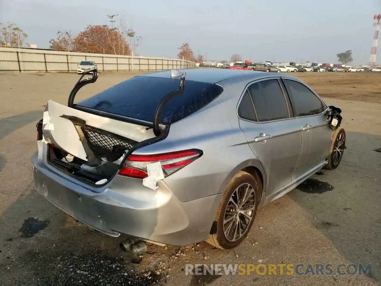 4 Photograph of a damaged car 4T1B11HK0KU787153 TOYOTA CAMRY 2019