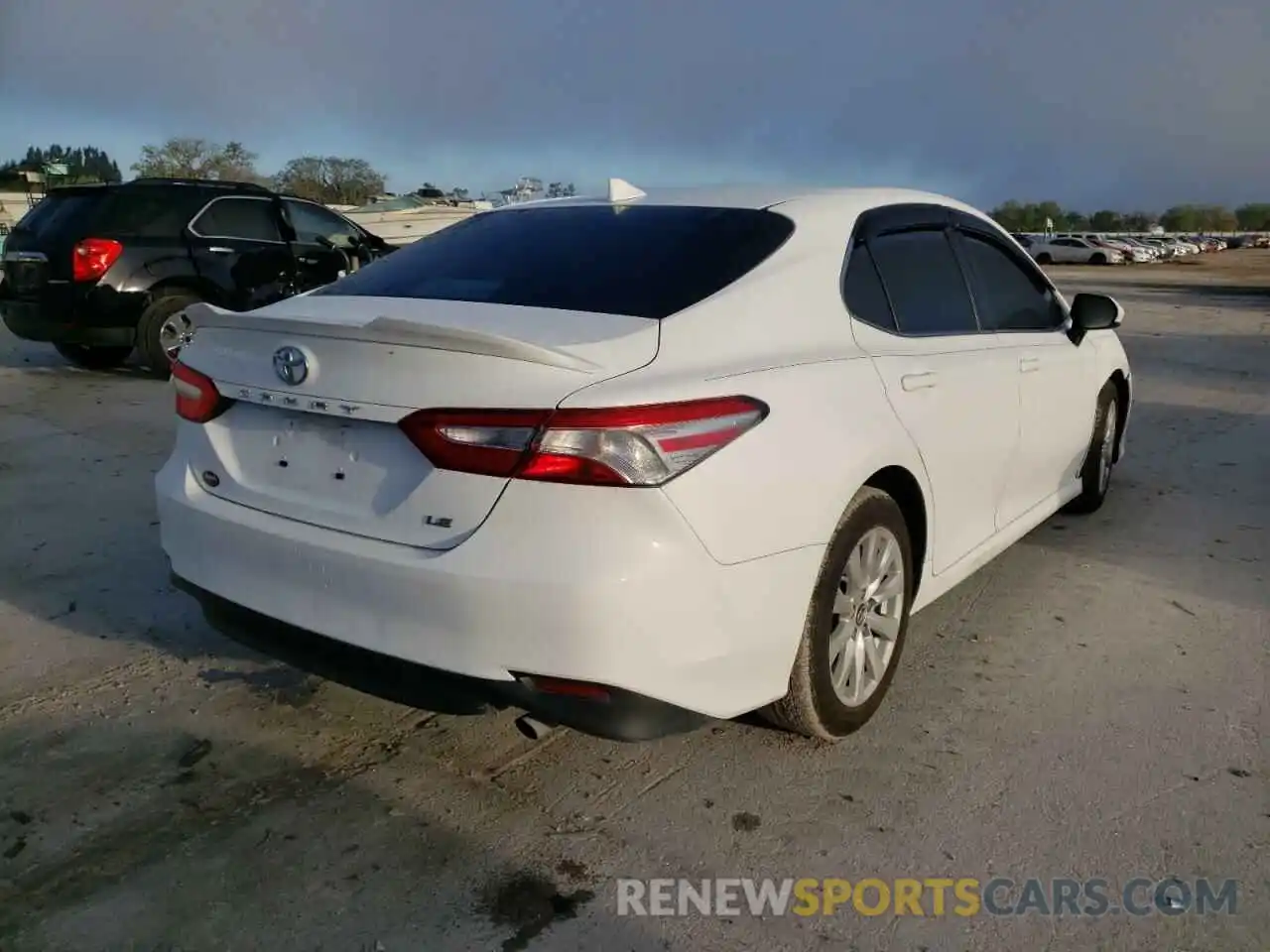 4 Photograph of a damaged car 4T1B11HK0KU787413 TOYOTA CAMRY 2019