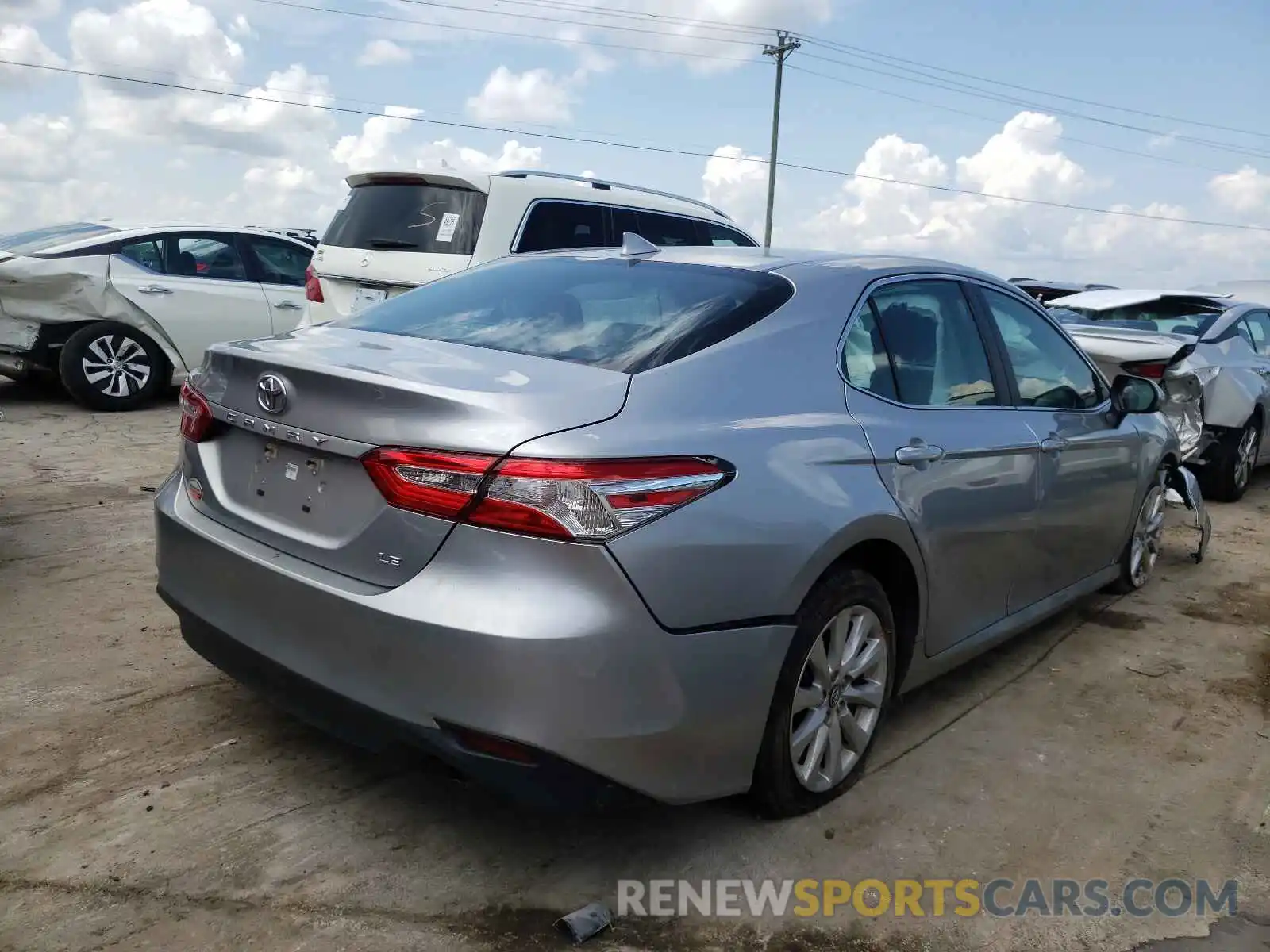 4 Photograph of a damaged car 4T1B11HK0KU806509 TOYOTA CAMRY 2019