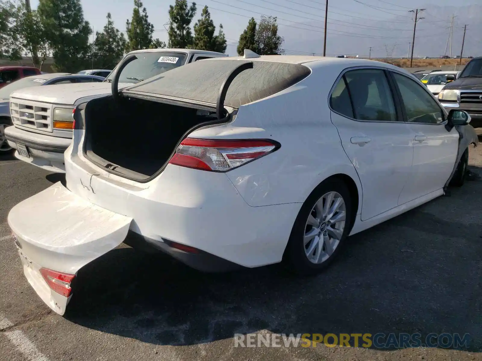 4 Photograph of a damaged car 4T1B11HK0KU807594 TOYOTA CAMRY 2019