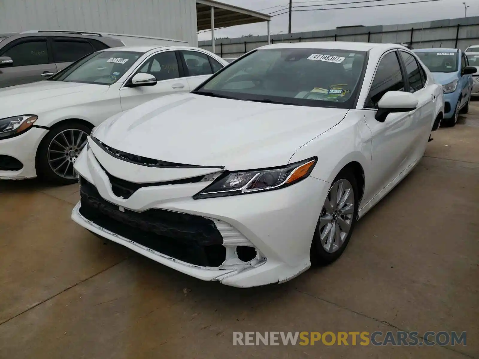 2 Photograph of a damaged car 4T1B11HK0KU823374 TOYOTA CAMRY 2019