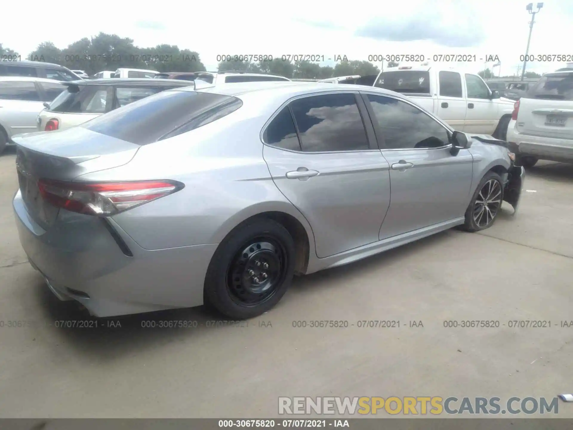 4 Photograph of a damaged car 4T1B11HK1KU199584 TOYOTA CAMRY 2019