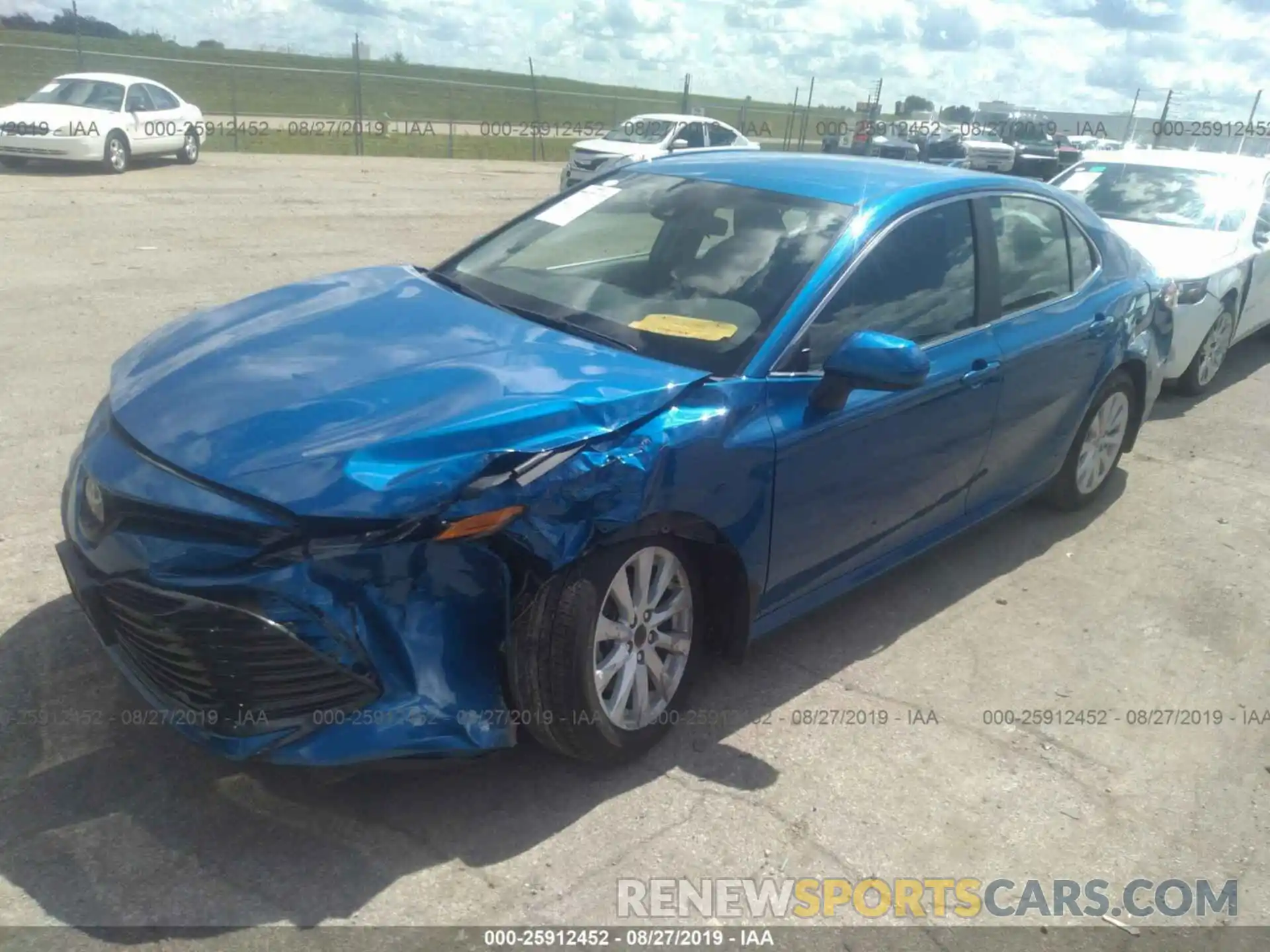 2 Photograph of a damaged car 4T1B11HK1KU205903 TOYOTA CAMRY 2019