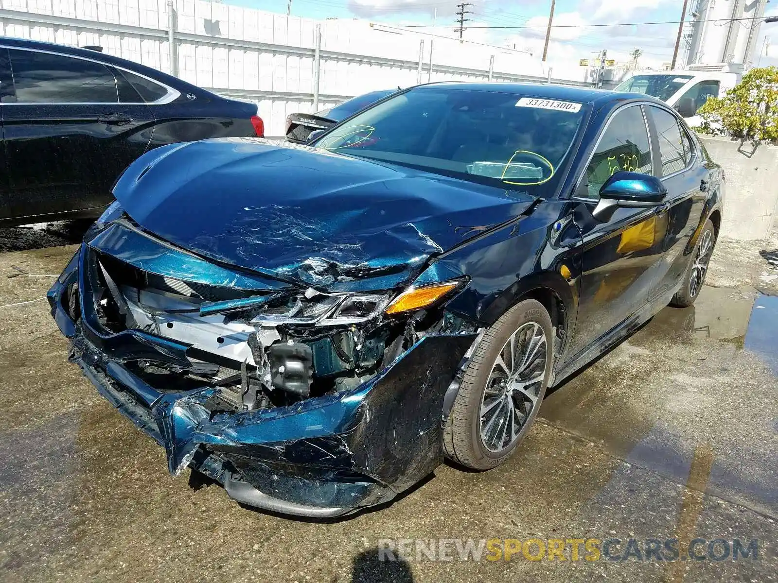 2 Photograph of a damaged car 4T1B11HK1KU256608 TOYOTA CAMRY 2019