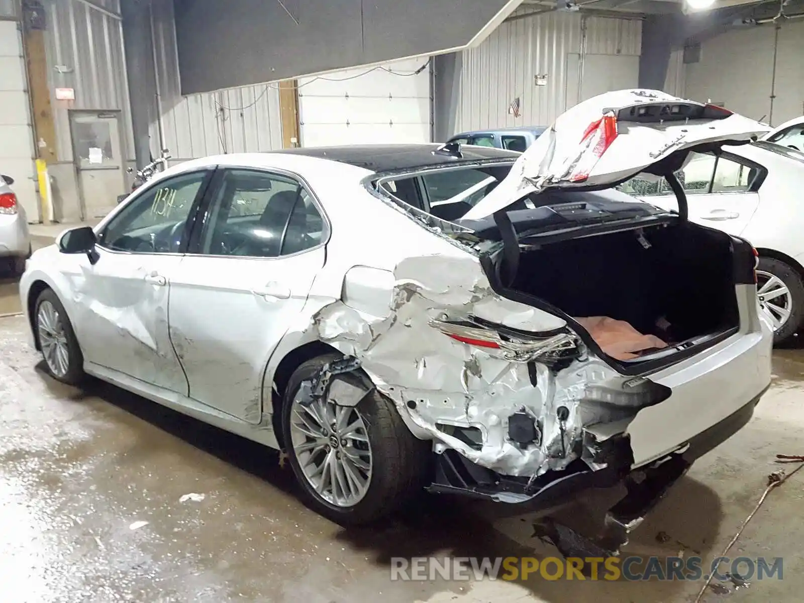 3 Photograph of a damaged car 4T1B11HK1KU706452 TOYOTA CAMRY 2019