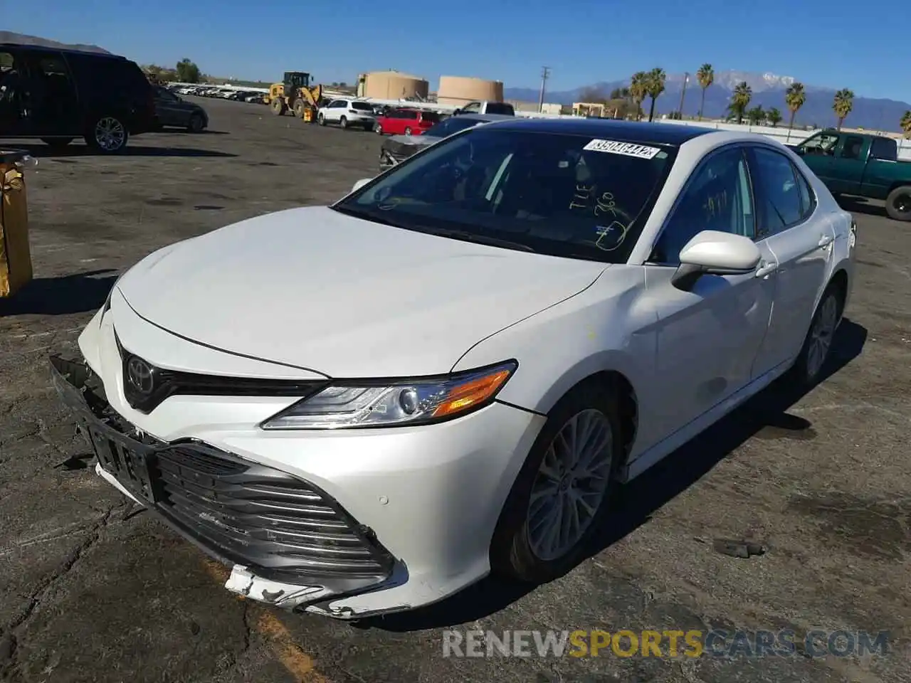 2 Photograph of a damaged car 4T1B11HK1KU713322 TOYOTA CAMRY 2019