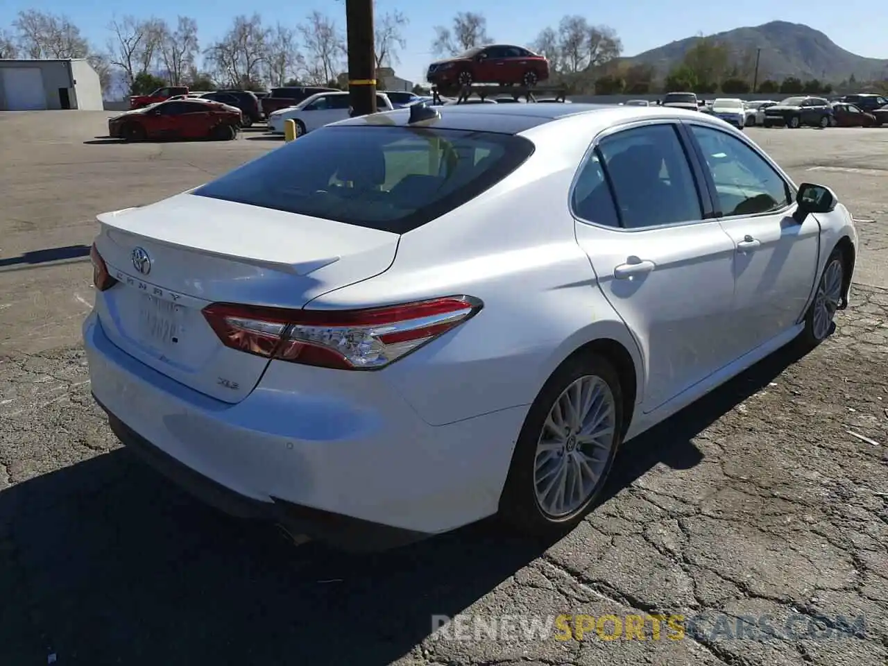 4 Photograph of a damaged car 4T1B11HK1KU713322 TOYOTA CAMRY 2019