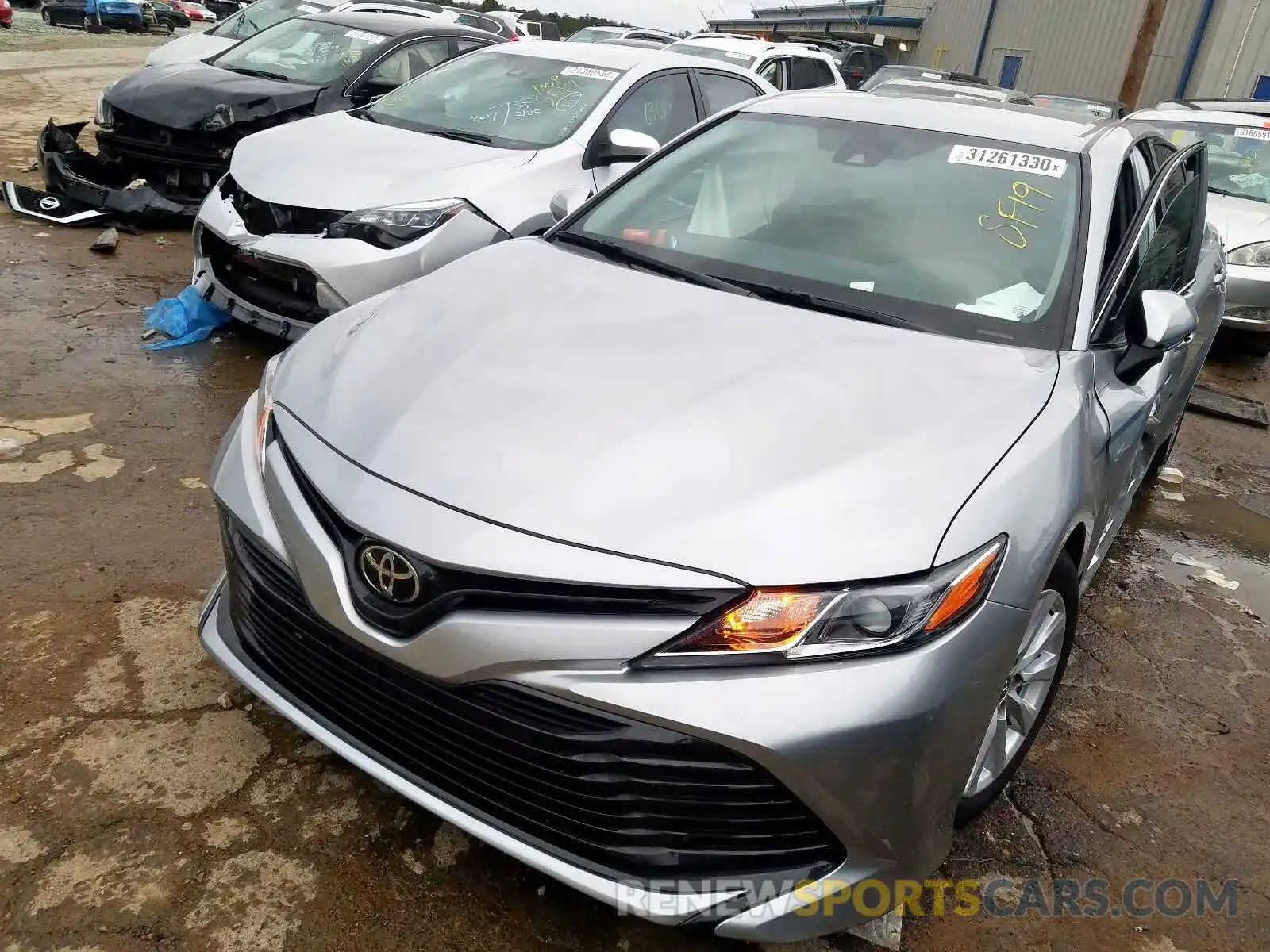 2 Photograph of a damaged car 4T1B11HK1KU713367 TOYOTA CAMRY 2019