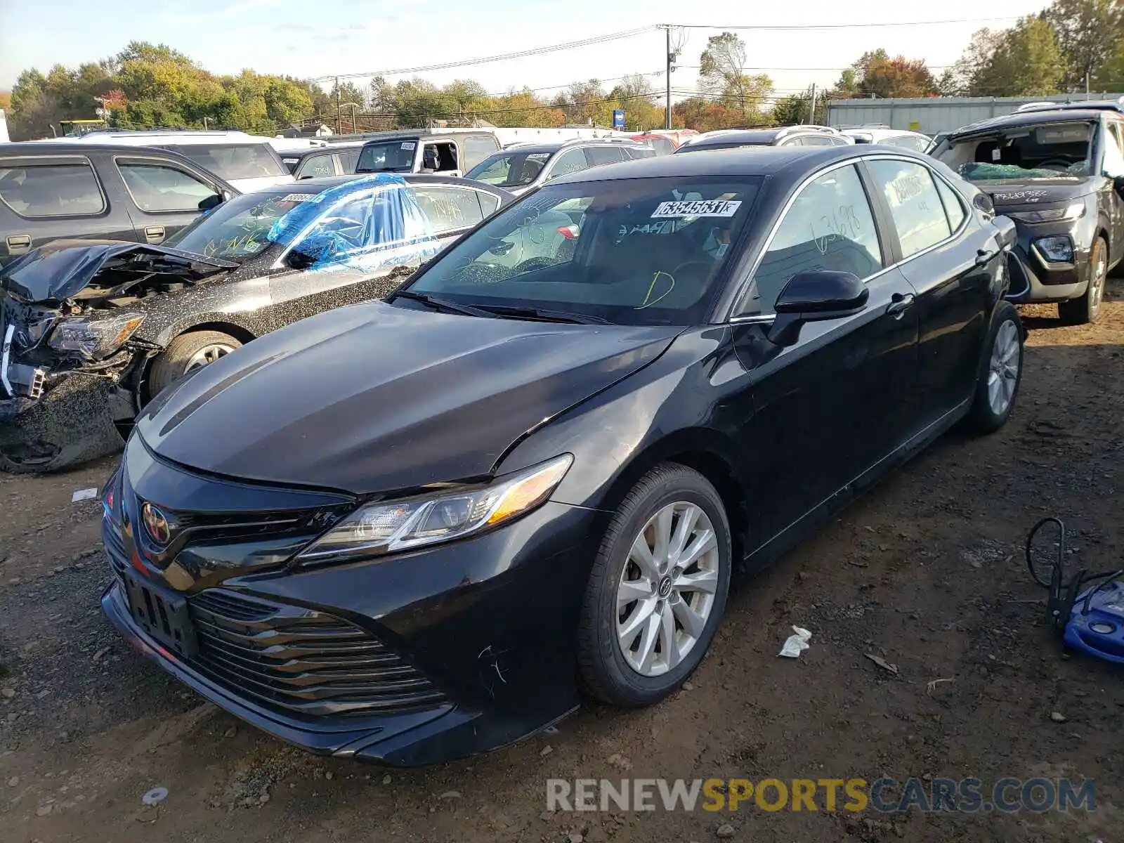 2 Photograph of a damaged car 4T1B11HK1KU717855 TOYOTA CAMRY 2019